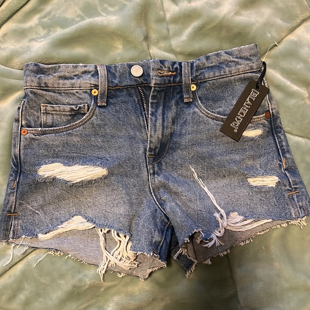 Jean shorts are too small on me , never worn. Tags are still on.